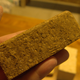 A small block of mycoterial: straw partly decayed and fused together with mushroom mycelium into a study, wood-like texture. All photos: Matthew Francis